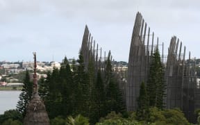 New Caledonia's Jean-Marie Tjibaou Cultural Centre meets the outer Noumea skyline.