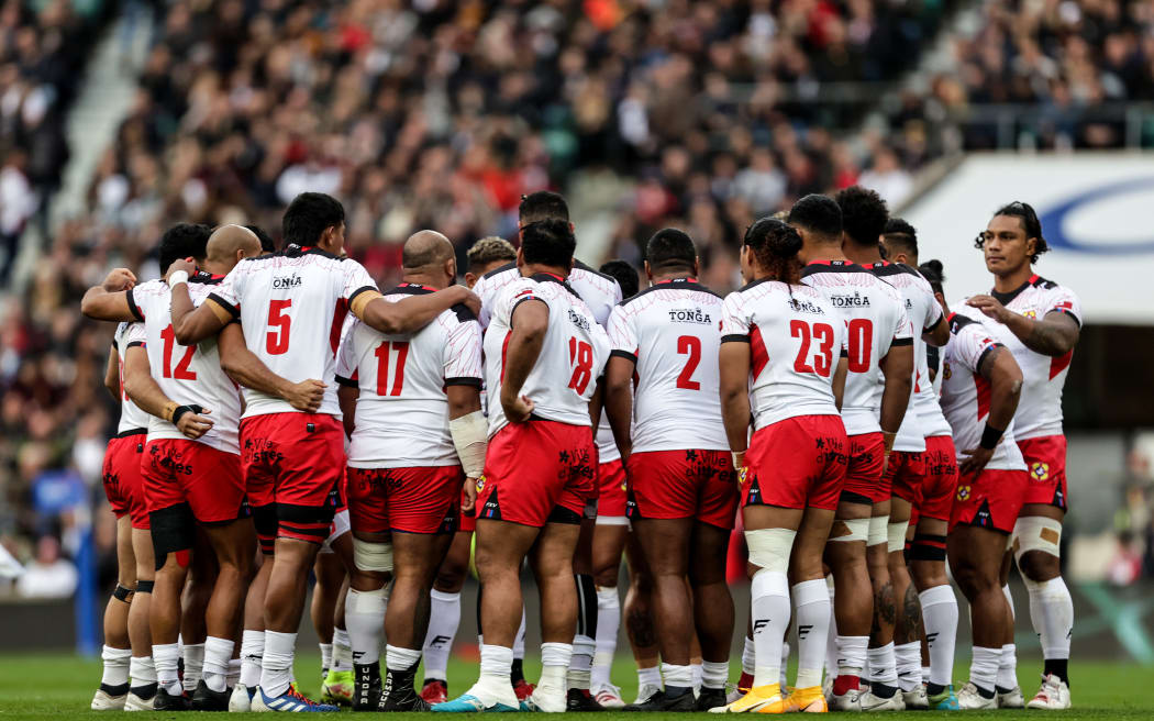 Tonga huddle together during their 69-3 defeat by England at Twickenham.