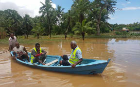 A Fiji Red Cross team assesses Waivou village, Fiji after a week of flooding in December 2016.