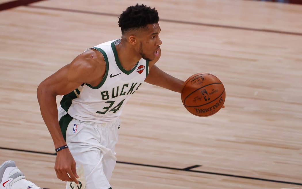 Giannis Antetokounmpo #34 of the Milwaukee Bucks moves the ball against the Orlando Magic during the first quarter in Game Five of the Eastern Conference First Round during the 2020 NBA Playoffs.