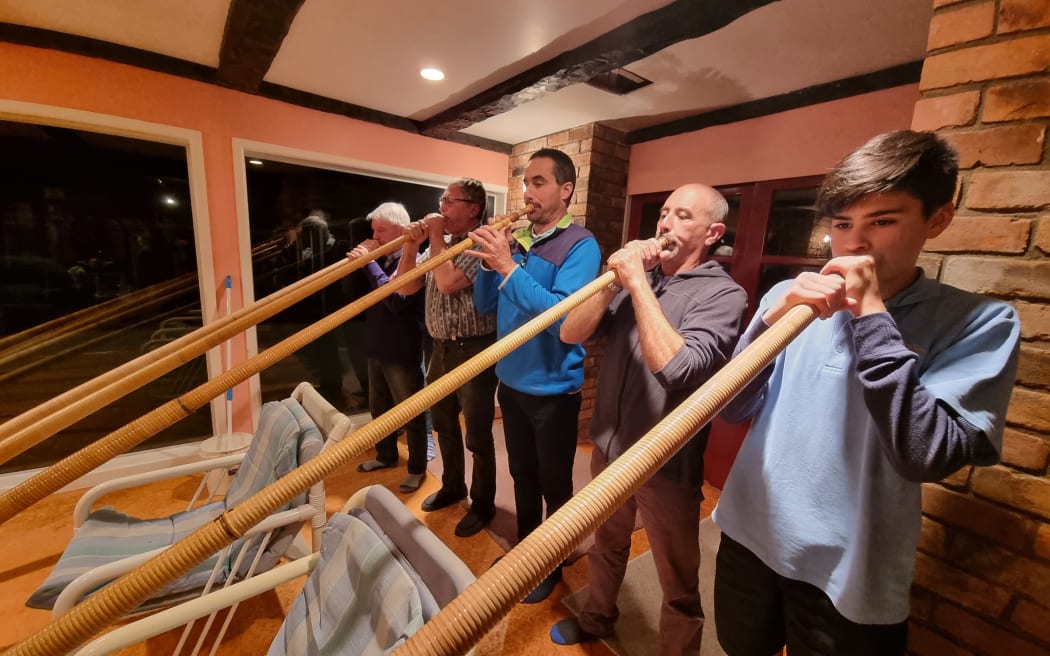 The members of the Taranaki Swiss Club play the alpine horns.