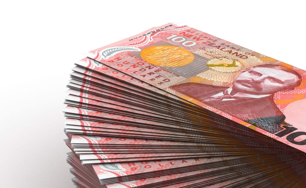 A stack of NZ $100 bills.