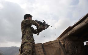 A member of Afghan security retaliates against Taliban insurgents during an operation in the Dur Baba district near the Pakistan-Afghanistan border last month.
