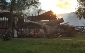 The remains of a building after it was set alight during violent clashes at the University of Technology in Lae, Papua New Guinea.