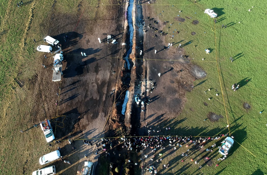 Aerial view of the scene where a massive blaze trigerred by a leaky pipeline took place.