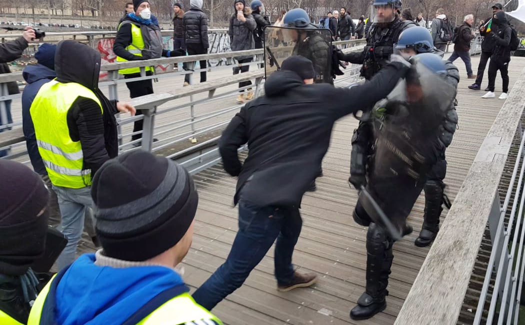 A video grab shows Christophe Dettinger fighting with riot police during a demonstration by "Gilets Jaunes" anti-government protestors.