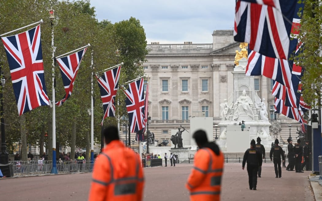 Police officers near Buckingham Palace in London, one day before  the state funeral for Queen Elizabeth II.