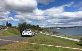 Police at the scene in Lake Taupō where two bodies were discovered.