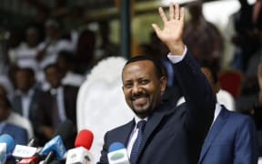(FILES) In this file photo taken on April 11, 2018 New Ethiopian Prime Minister Abiy Ahmed waves during his rally in Ambo, about 120km west of Addis Ababa, Ethiopia.