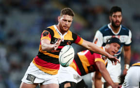 Tawera Kerr-Barlow of Waikato puts in a kick in Mitre 10 Cup match against Auckland