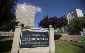 The sun reflects off of the Leaside Towers in Toronto, Ontario, July 6, 2018, where accused serial killer Bruce McArthur lived at the time of his arrest. Canadian police announced the discovery of human remains buried at a Toronto property where McArthur worked as a landscape gardener.