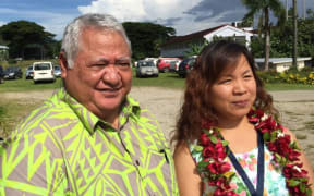 Samoa's PM Tuilaepa Sailele Malielegaoi poses with a delegate from China in Samoa.