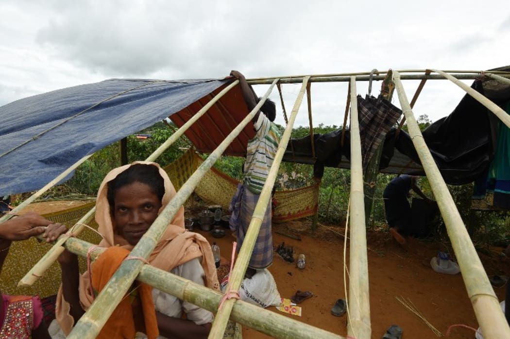 Rohingya refugees build a new makeshift shelters in the refugee camp of Thyangkhali near the Bangladeshi village of Gumdhum, on September 18, 2017. More than 400,000 Rohingya Muslims have now arrived in Bangladesh from their Buddhist do