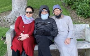 Gulamhusen Gulammustufa Shaikh (centre) was facing deportation but is now able to remain in New Zealand with his daughter Anisha Shaikh (left) and son Asif Shaikh (right).