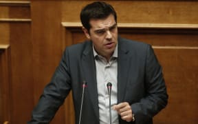 Greece's Prime Minister Alexis Tsipras delivers a speech during a parliament meeting in Athens.