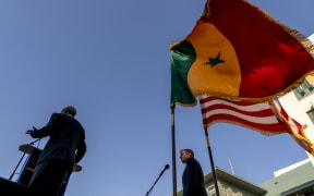 US Secretary of State Antony Blinken (R) looks on as he is introduced by US Ambassador to Senegal Tulinabo Mushingi (L) as he greets employees and their families at the US Embassy in Dakar, on November 20, 2021.