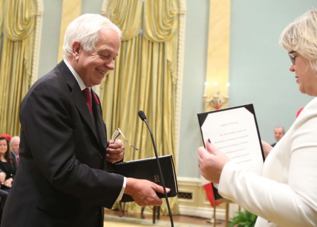 Canada's new Immigration, Citizenship and Refugees Minister John McCallum (L) is sworn-in as Prime Minister Justin Trudeau watches during a swearing-in ceremony at Rideau Hall in Ottawa on November 4, 2015.