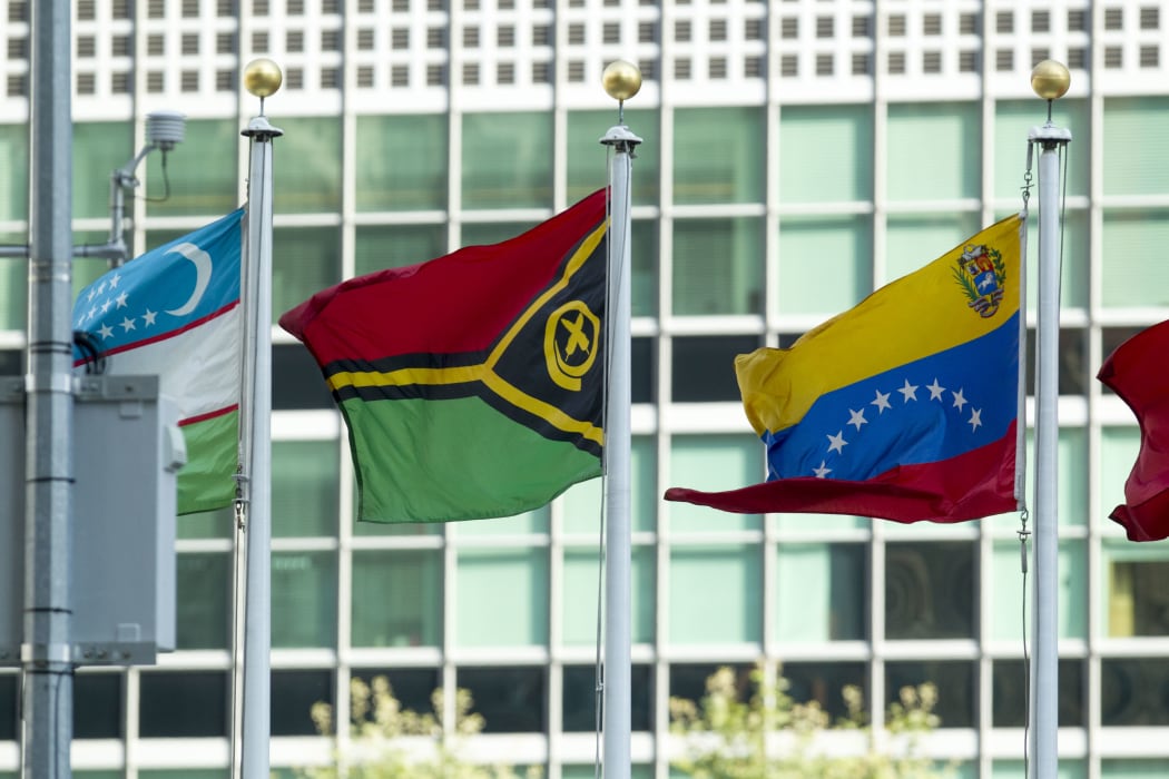 The flag of the Republic of Vanuatu (centre) flying at United Nations headquarters in New York.