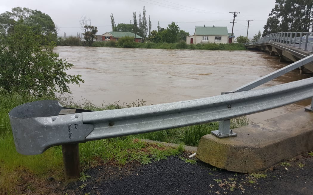 Rising floodwaters threaten Henley.