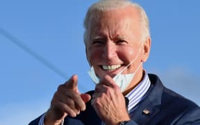 (FILES) In this file photo taken on October 24, 2020 Democratic presidential nominee and former Vice President Joe Biden speaks at a Drive-In event with Bon Jovi at Dallas High School, Pennsylvania.