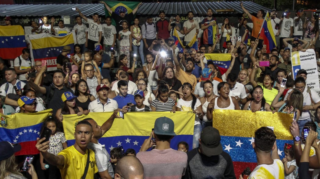 Venezuelans opposed to President Nicolas Maduro hold a demonstration in Sao Paulo, Brazil in support of opposition leader Juan Guaido's self-proclamation as acting president of Venezuela, on January 23, 2019.