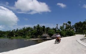 A motorbike on a road in Kiribati