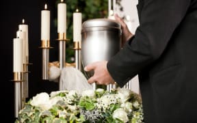 Funeral casket. Cremation urn.