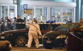 Italian police officers secure traces after the suspect of the Berlin attack Anis Amri had been killed during a shoot-out with police forces in Milan, Italy, 23 December 2016.