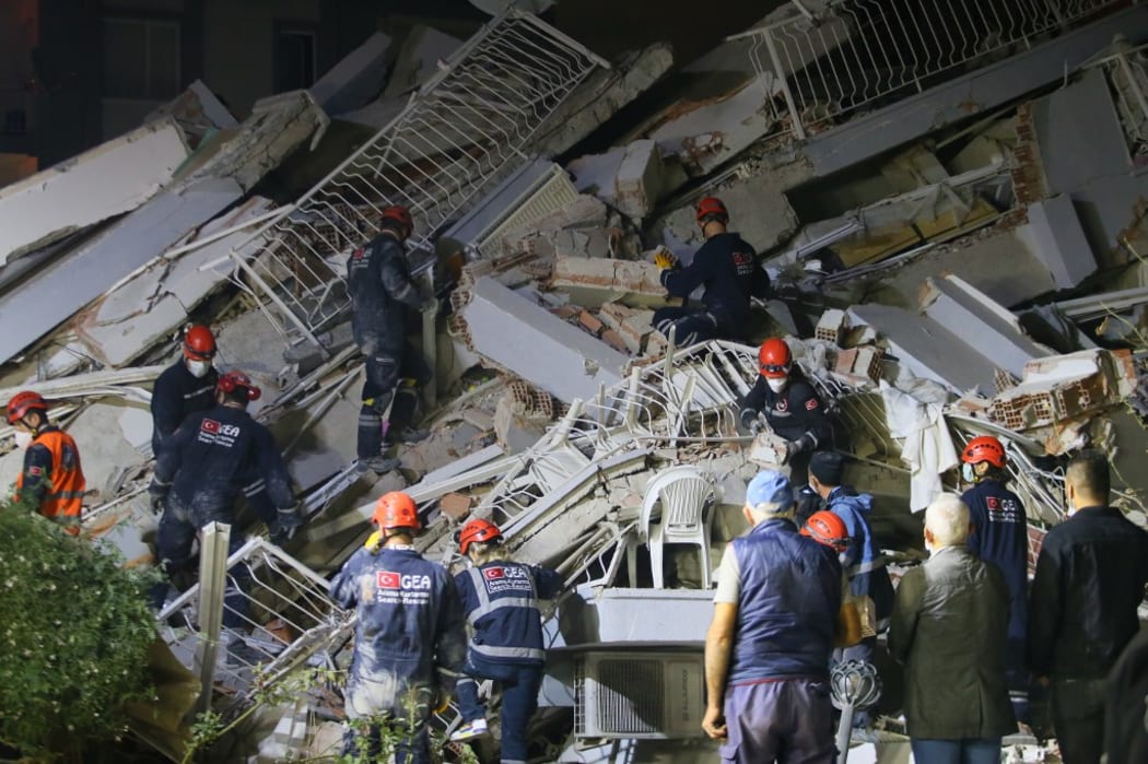 IZMIR, TURKEY - OCTOBER 30: Search and rescue works continue at debris of buildings after a magnitude 6.6 quake shook Turkey's Aegean Sea coast, in Izmir, Turkey on October 30, 2020.