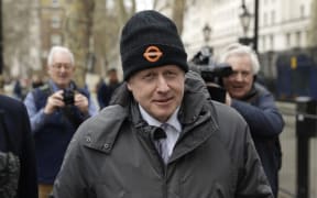 FILE - In this Tuesday, March 19, 2019 file photo Boris Johnson, Britain's former Foreign Secretary and prominent leave the European Union Brexit campaigner walks away after leaving the Cabinet Office in London. A British judge has ruled that former Foreign Secretary Boris Johnson