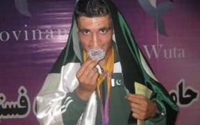 Ezatullah Kakar with his silver medal.