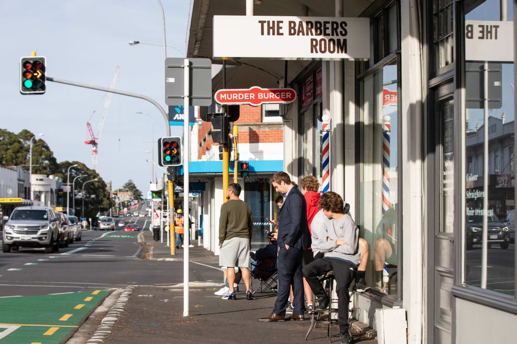 A queue outside The Barbers Room on Dominion Rd, Mt Eden, 14 May. NZ is in level 2 after seven weeks of lockdown restrictions.