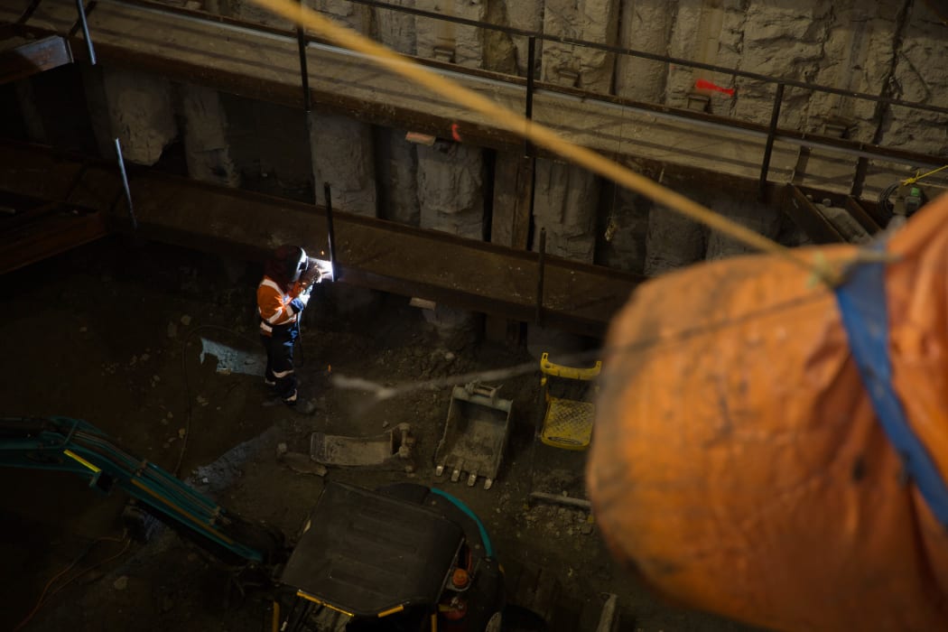 A welder works on the City Rail Link project