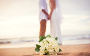 Just married couple holding hands on the beach, Hawaii Beach Wedding