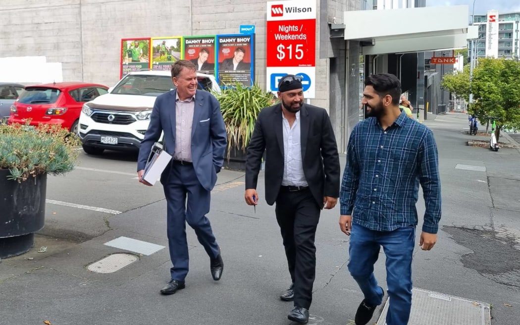 Deepak Dhiman [right], with advocates John Wood [left] and Sunny Sehgal [centre], walk out of the Employment Relations Authority after a compliance meeting in March that Devinder Mann failed to attend