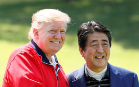 US President Donald Trump, left, and Japan's Prime Minister Shinzo Abe before playing a round of golf at Mobara Country Club in Chiba.