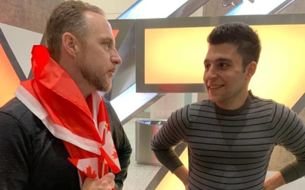 Stephen Watt greets Amir Sahragard at Toronto Airport.