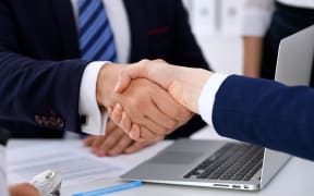 Business handshake at meeting or negotiation in the office.