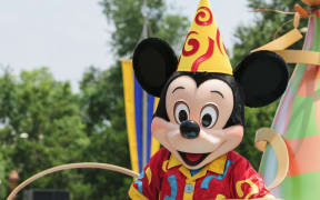 Mickey Mouse during a parade at Disneyland.