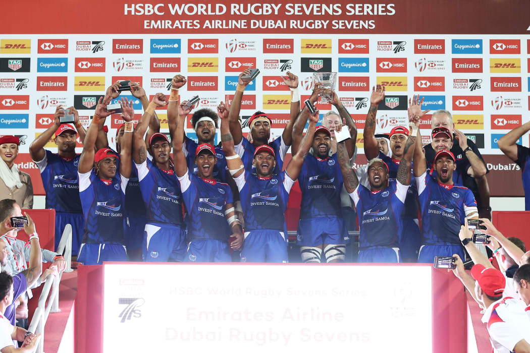 Samoa celebrates winning the Challenge Trophy at the Dubai Sevens.