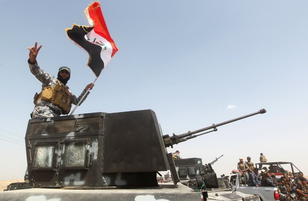 Iraqi security forces and paramilitaries deploy north-west of Baghdad before a major offensive to retake the city of Ramadi from Islamic State.