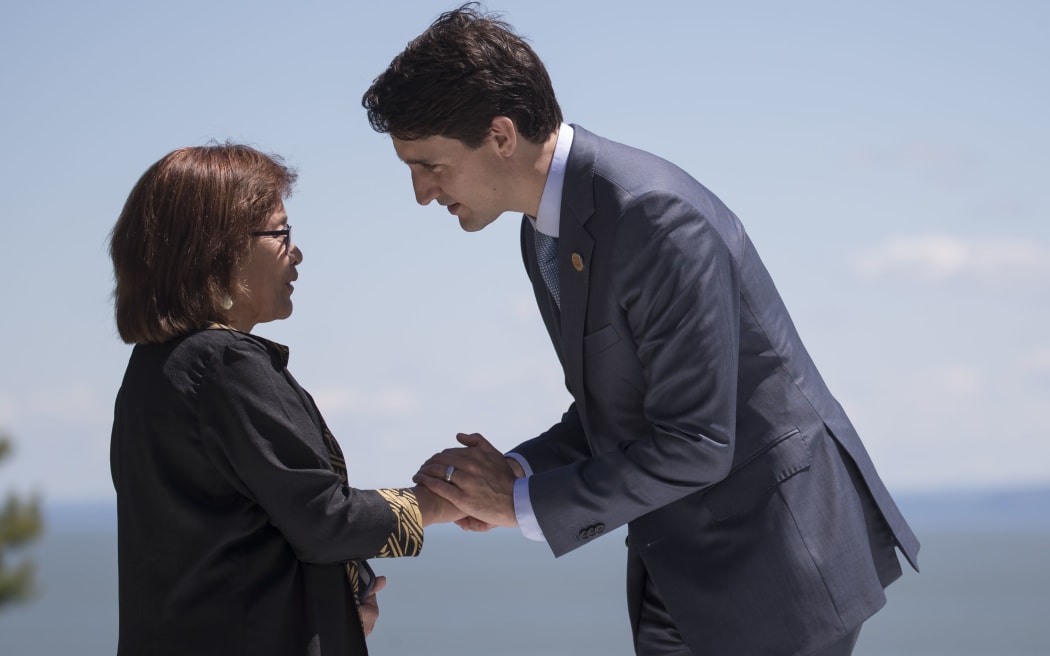 Hilda Heine, (left), is greeted by Canada PM Justin Trudeau at the G7 summit