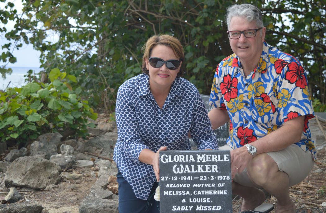 Cate Walker and Paul Morrissey beside the grave of Cate's late mother Gloria Walker. Cate has repainted and refreshed her mother's grave since it was left abandoned.