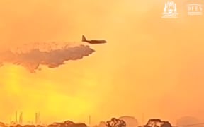 Large Air Tanker supporting firefighters at the City of Kwinana bushfire, in Perth, Western Australia.