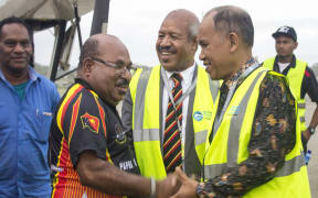 Governor Parkop welcoming his Indonesia's Papuan counterpart Lukas Enembe at the Jackson's International Airport.