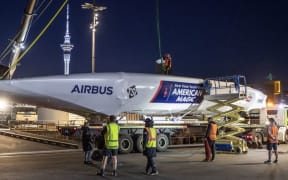 Patriot, the second AC75 racing yacht built by America's Cup Challenger New York Yacht Club American Magic, is unloaded in Auckland.