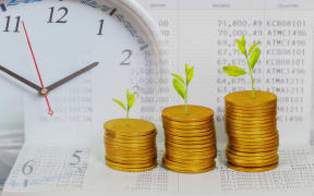 Tree growing on coins stack ,concept of investment growth.