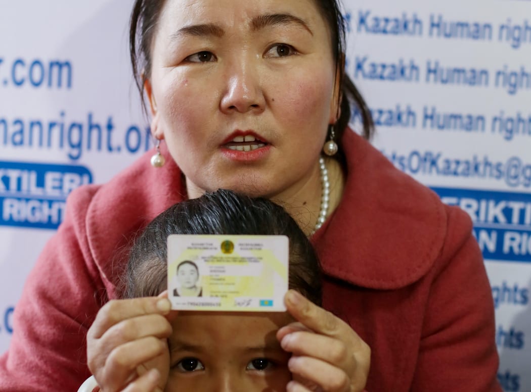 Gulzira Auelkhan, who spent close to two years trapped in China, speaks during an AFP interview at the office of the Ata Jurt rights group in Almaty, Kazakhstan, on January 21, 2019. She is pictured with her five-year-old daughter.