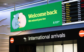 Auckland Airport welcome back sign.