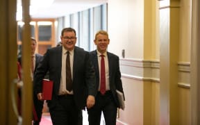 Finance Minister Grant Robertson and Prime Minister Chris Hipkins walk to the Parliament chamber for the delivery of the 2023 Budget, 18 May 2023.